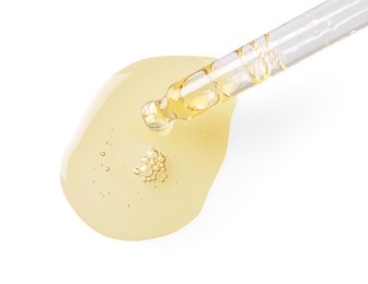 Image of Drop of hydrophilic oil from pipette on white background