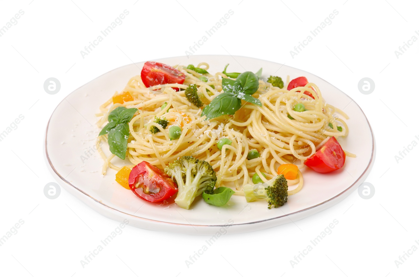 Photo of Plate of delicious pasta primavera with tomatoes, basil and broccoli isolated on white