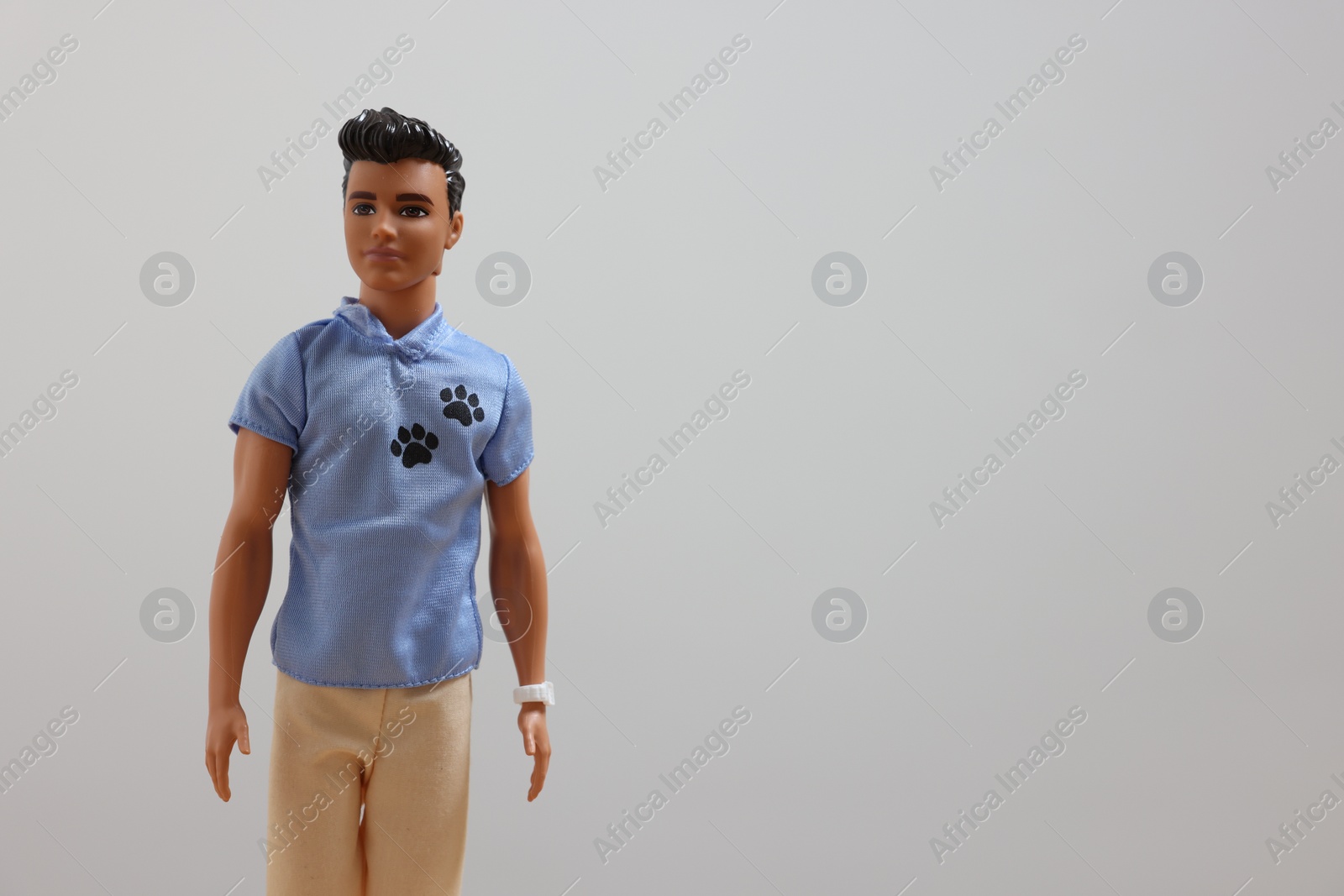 Photo of Leiden, Netherlands - September 20, 2023: Stylish Ken doll on light gray background, space for text