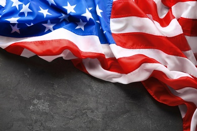 Photo of American flag on grey background, top view with space for text