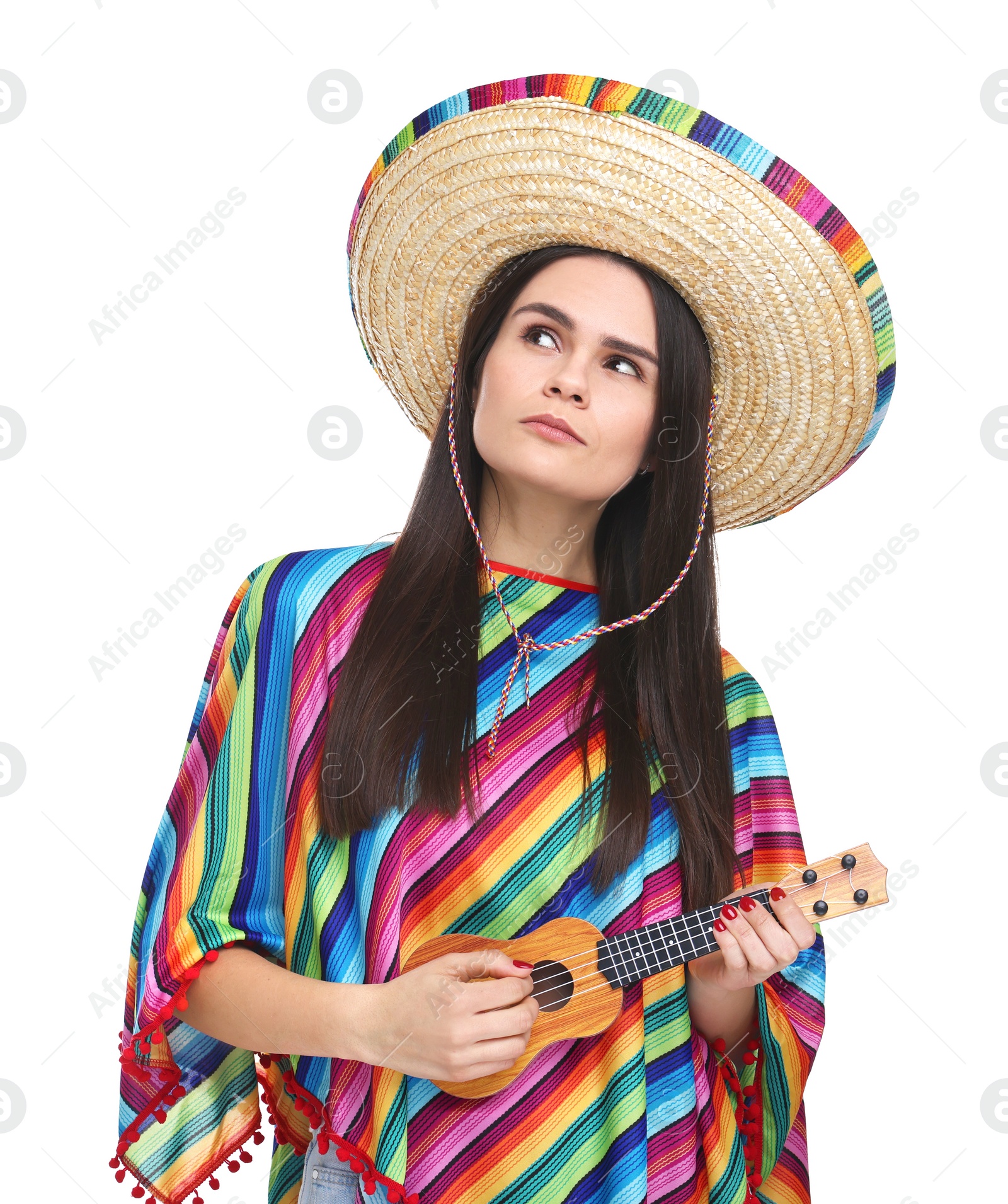 Photo of Young woman in Mexican sombrero hat and poncho playing ukulele on white background