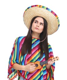 Young woman in Mexican sombrero hat and poncho playing ukulele on white background