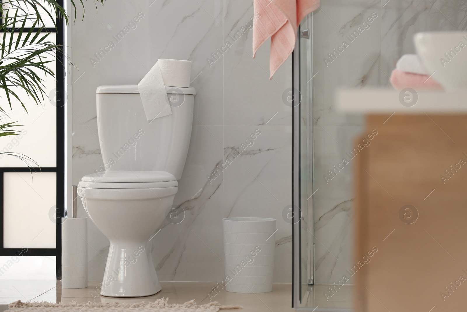 Photo of Interior of modern bathroom with toilet bowl