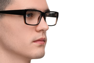 Photo of Young man with glasses on white background, closeup