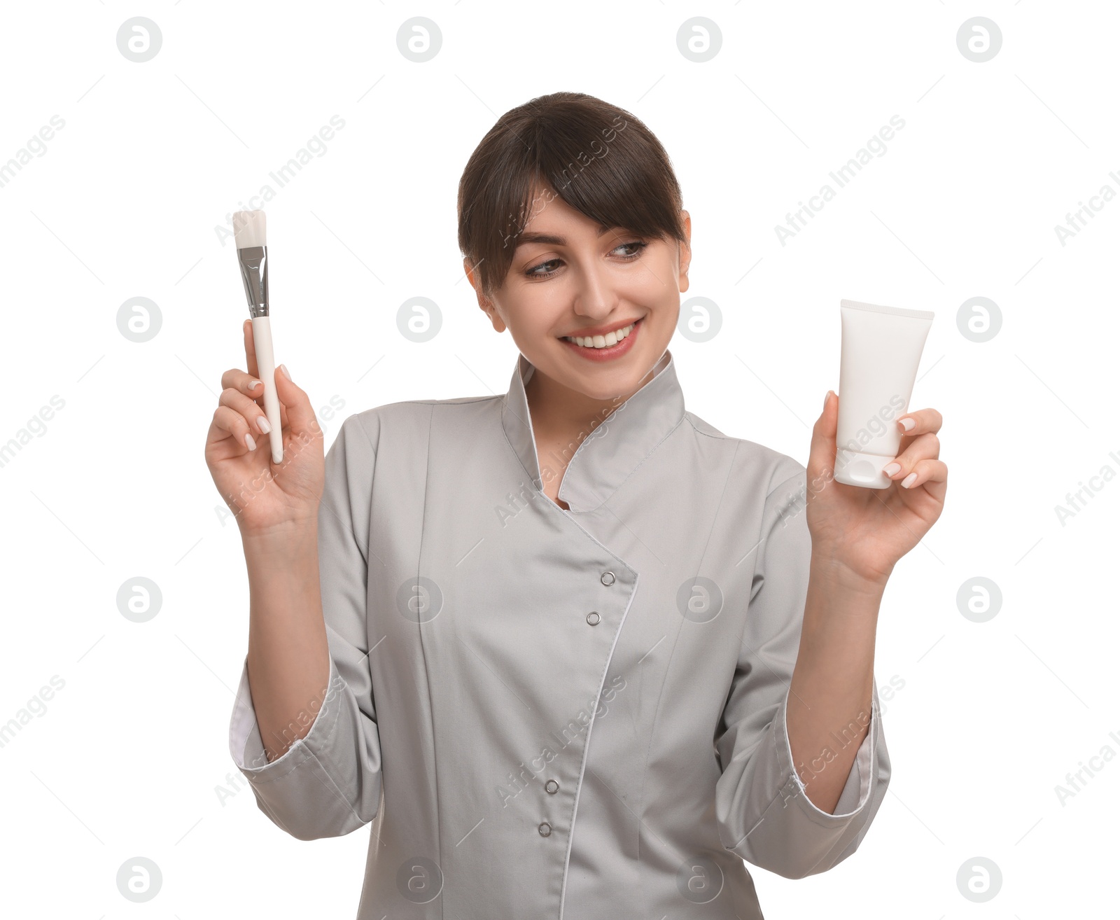 Photo of Cosmetologist with cosmetic product and brush on white background