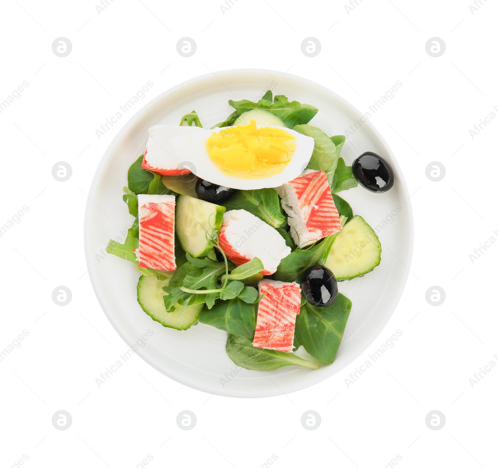 Photo of Delicious crab stick salad isolated on white, top view