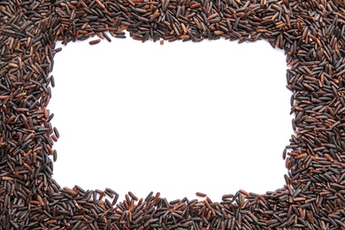 Photo of Frame made of uncooked black rice on white background, top view. Space for text