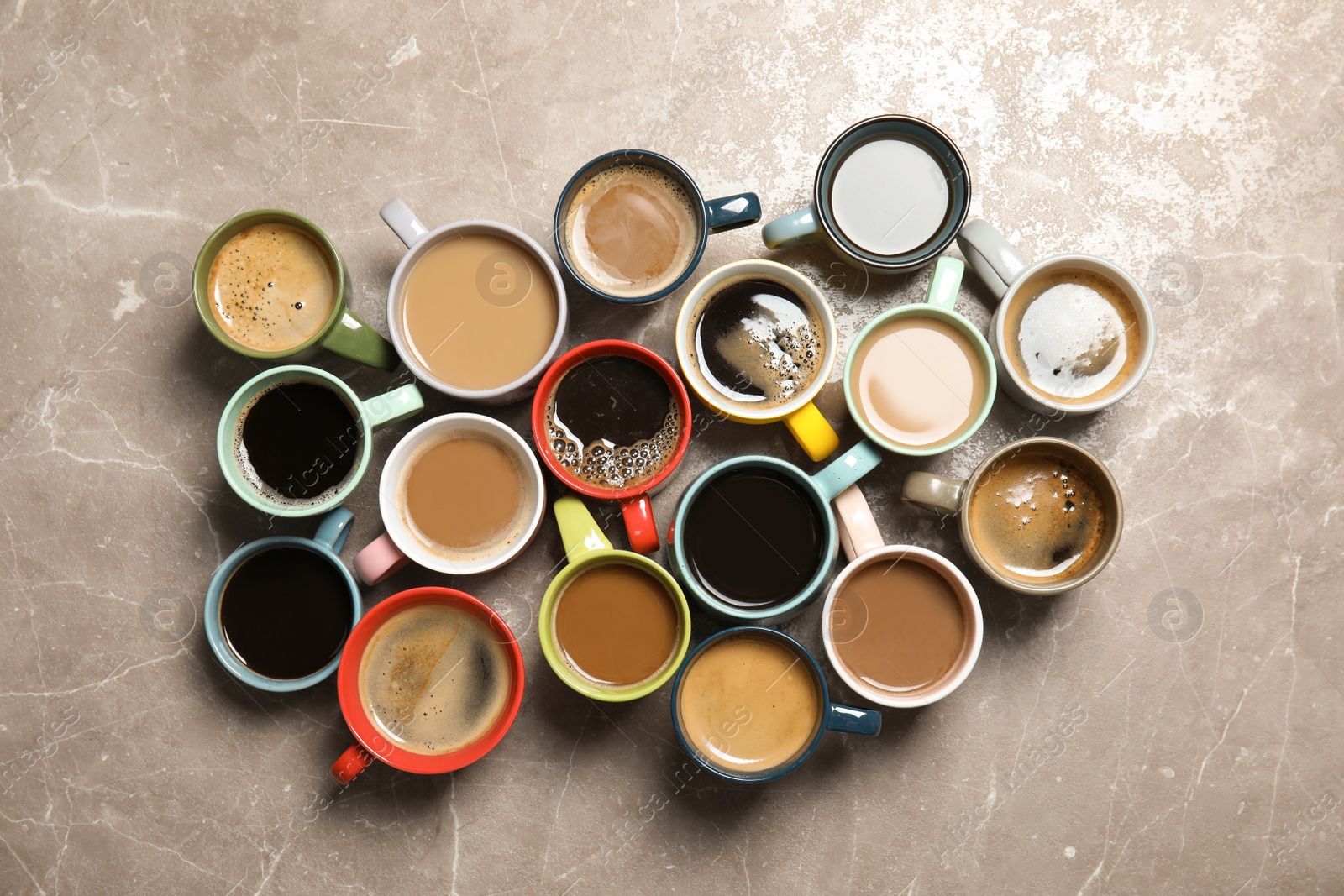 Photo of Flat lay composition with cups of coffee on gray background. Food photography