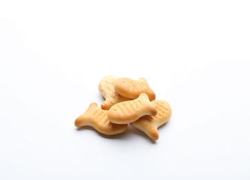 Photo of Delicious crispy goldfish crackers on white background