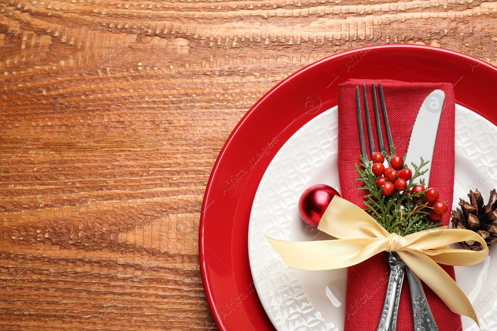 Photo of Beautiful Christmas table setting on wooden background, top view