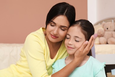 Photo of Happy mother and daughter at home. Single parenting