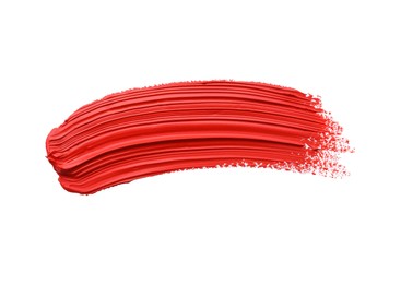 Photo of Red oil paint stroke on white background, top view