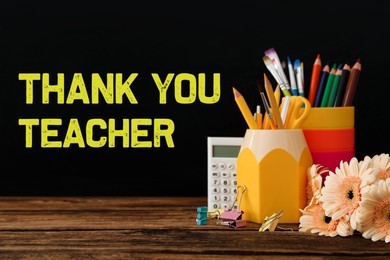 Image of Set of stationery and flowers on wooden table near blackboard with phrase Thank You Teacher