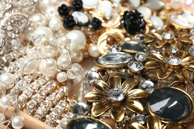 Different stylish jewelry as background, closeup view