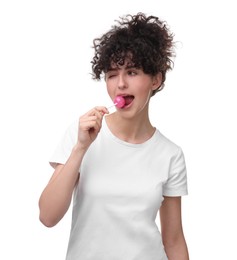 Beautiful woman with lollipop winking on white background