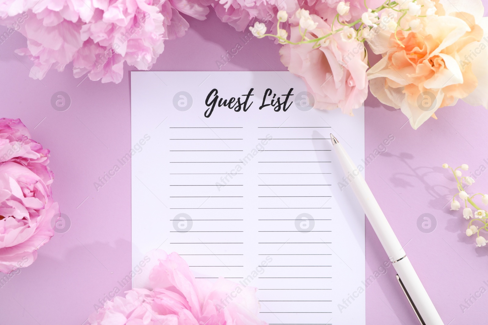 Photo of Guest list, pen and beautiful flowers on violet background, flat lay. Space for text