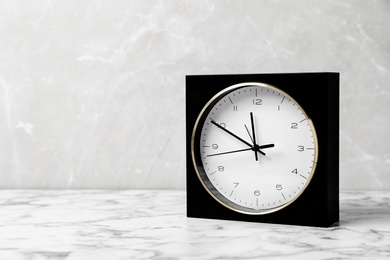 Modern clock on marble table. Time management