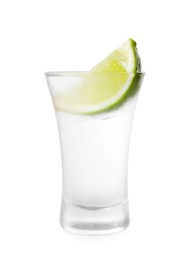 Photo of Shot glass of vodka and lime isolated on white