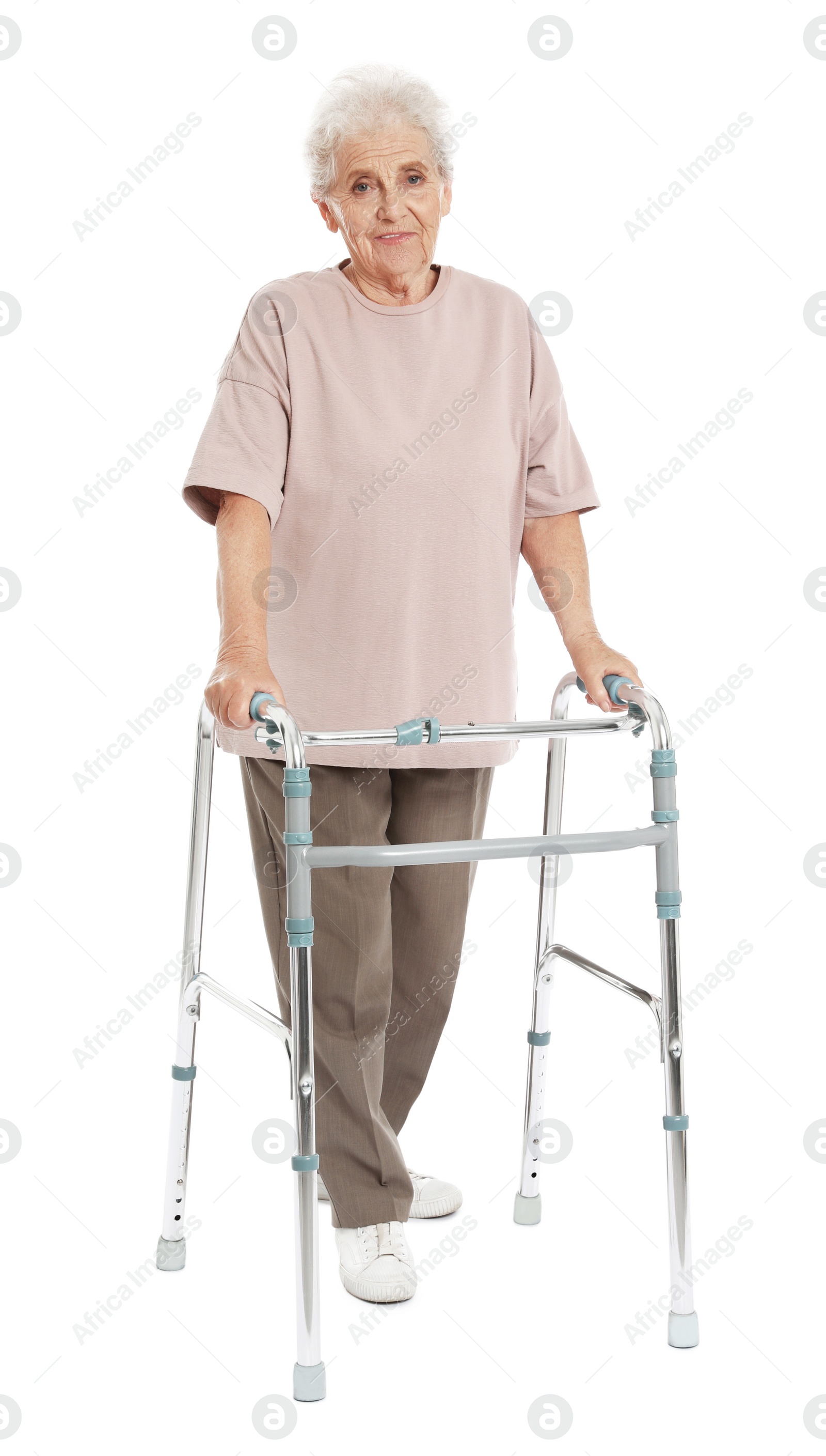 Photo of Full length portrait of elderly woman using walking frame isolated on white