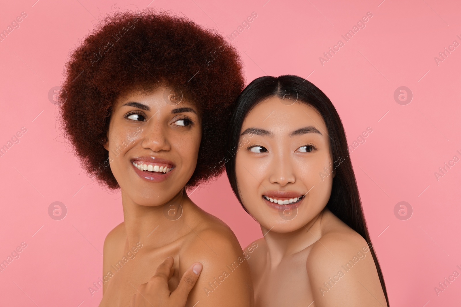 Photo of Portrait of beautiful young women on pink background