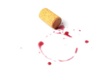 Bottle cork with wine stains on white background