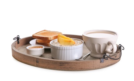 Wooden tray with delicious breakfast on white background