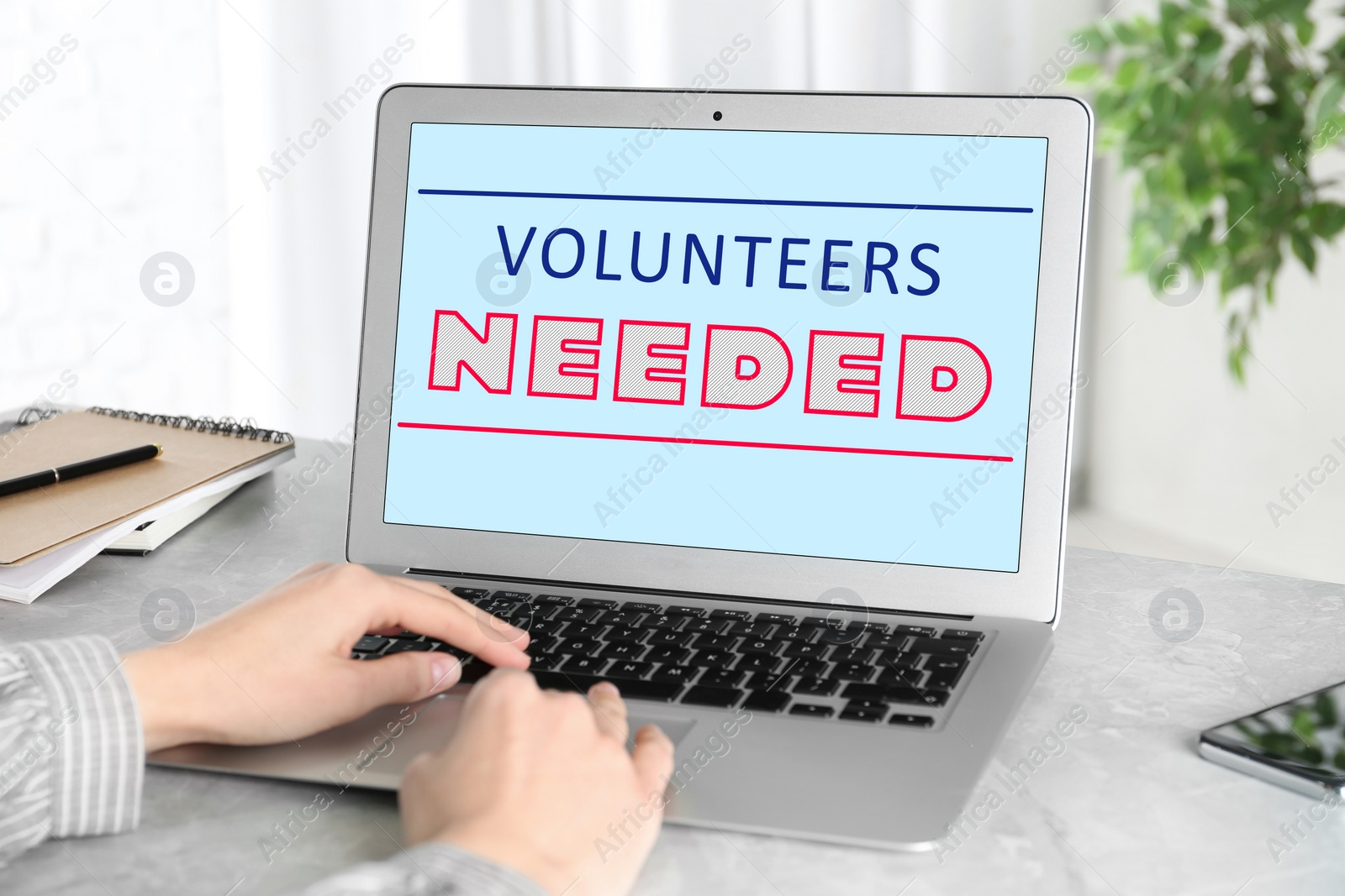 Image of Woman using laptop at desk in office, closeup. Volunteers needed