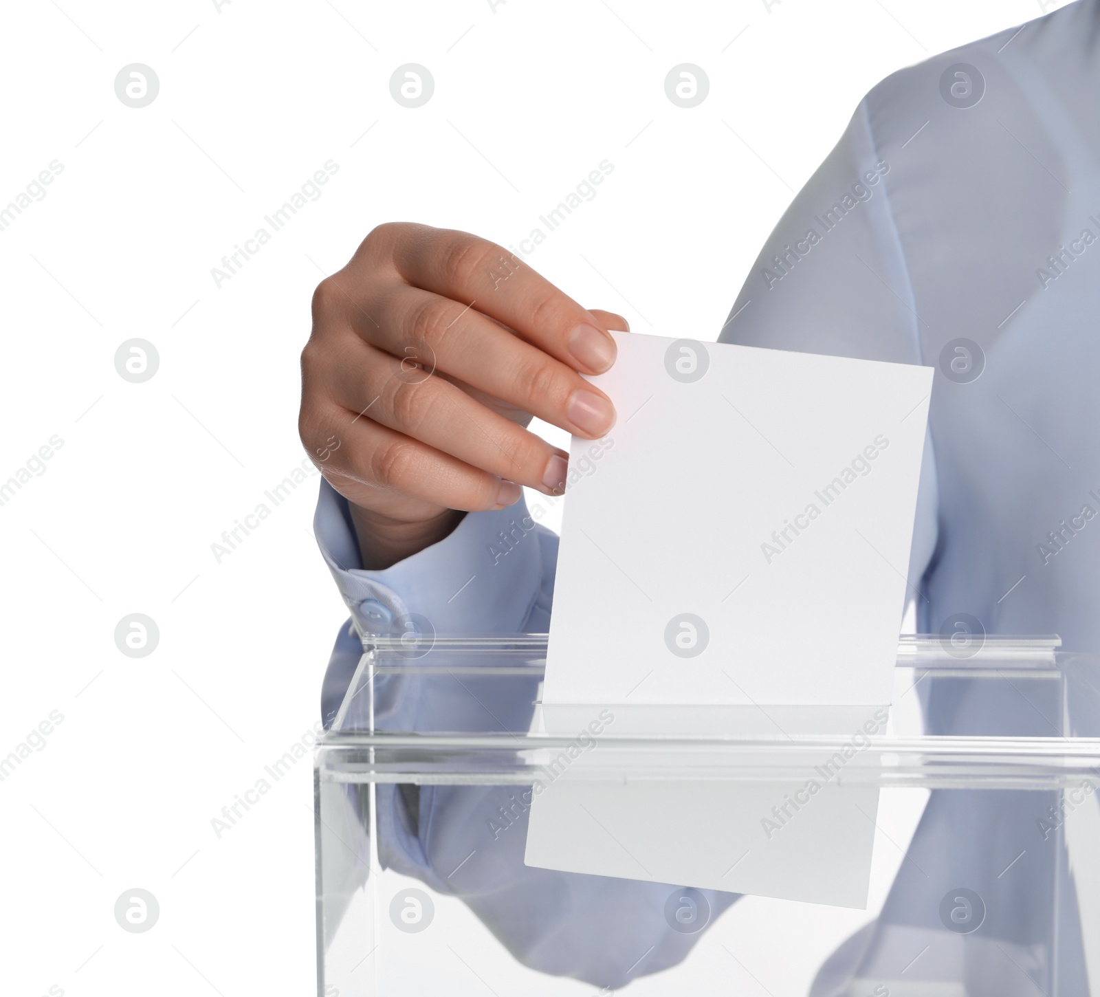 Photo of Woman putting her vote into ballot box on white background, closeup