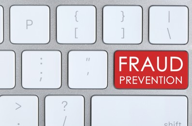 Image of Red button with phrase Fraud Prevention on computer keyboard, top view