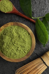 Flat lay composition with green matcha powder on grey table