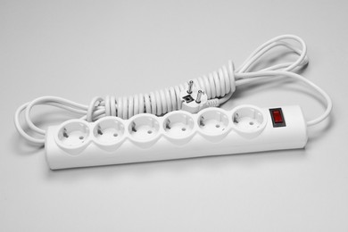 New power strip on white background. Electrician's equipment