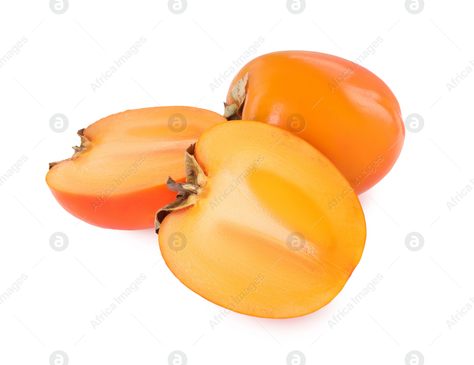 Photo of Whole and cut persimmon fruits isolated on white