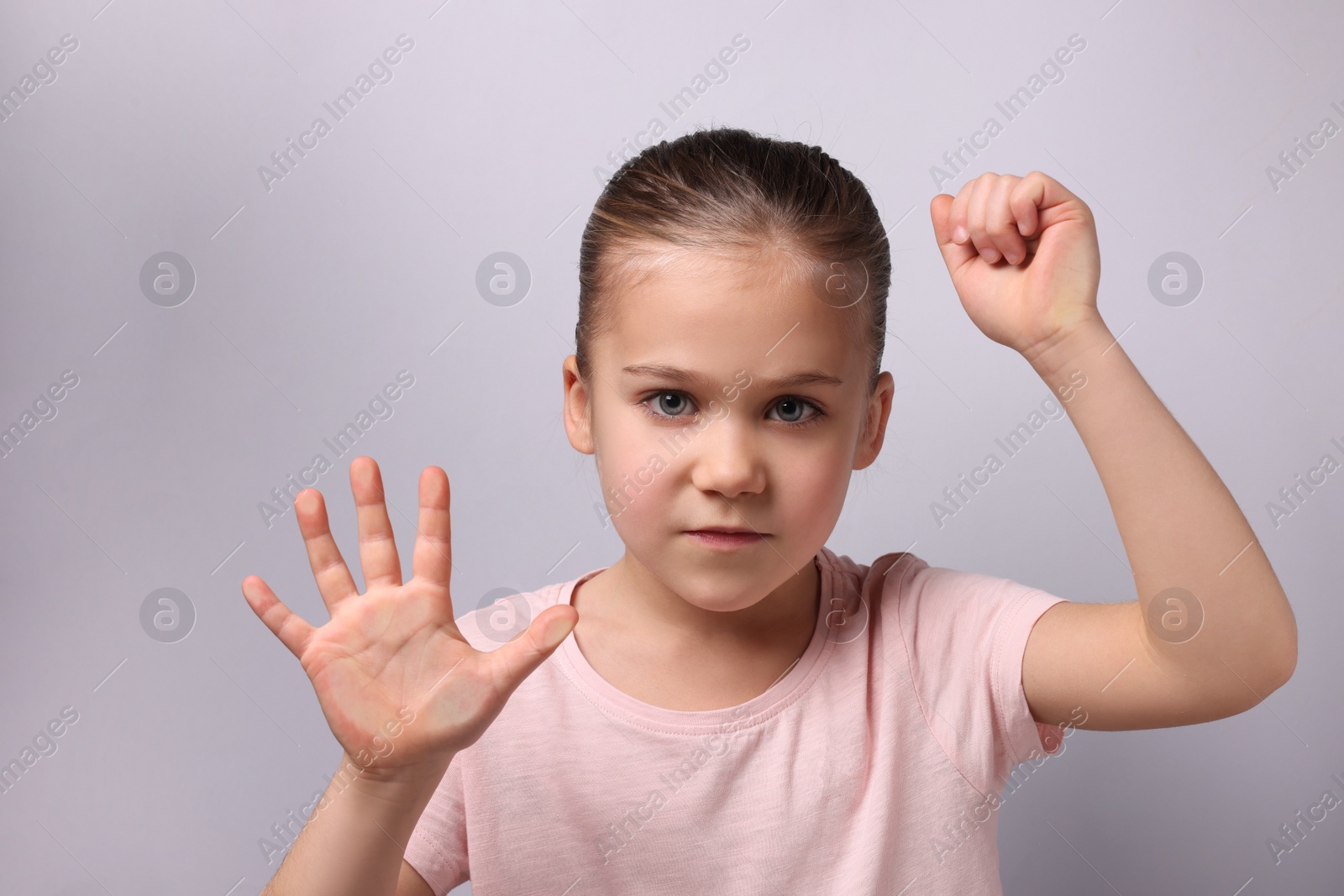 Photo of Cute little girl stuck to transparent screen