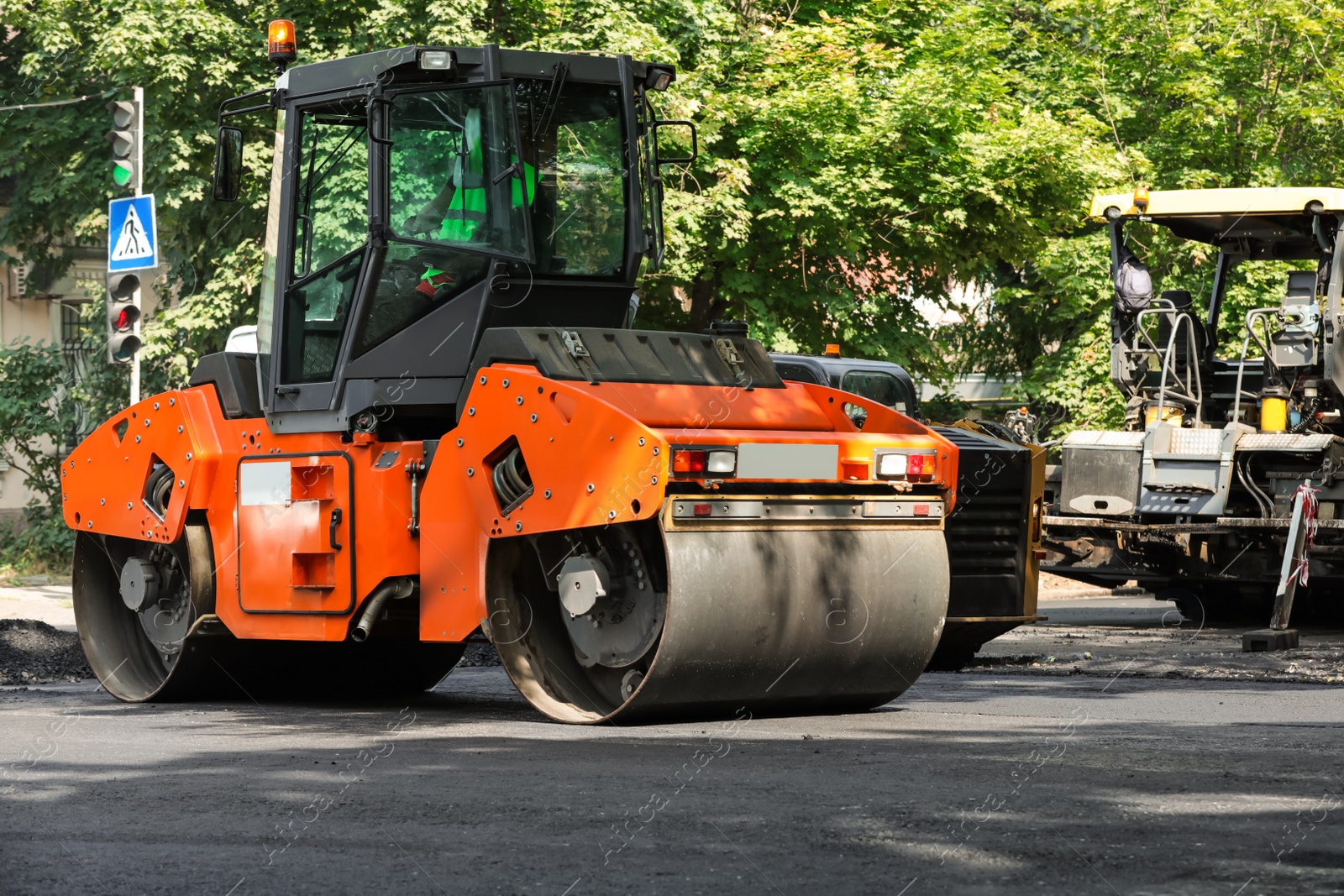 Photo of Road repair machinery working on city street