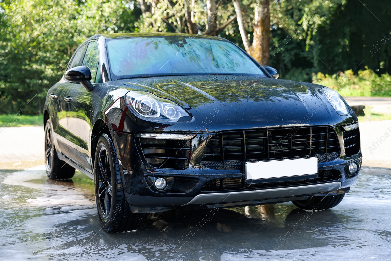 Photo of Clean auto after washing at outdoor car wash