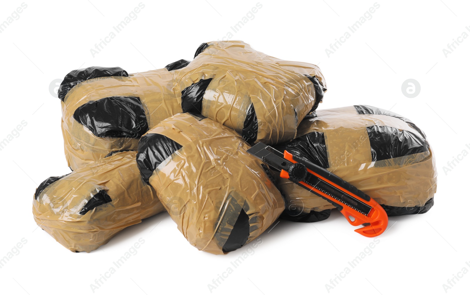 Photo of Packages with narcotics and stationery knife isolated on white