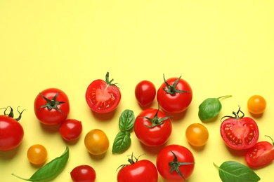 Photo of Flat lay composition with cherry tomatoes on color background. Space for text