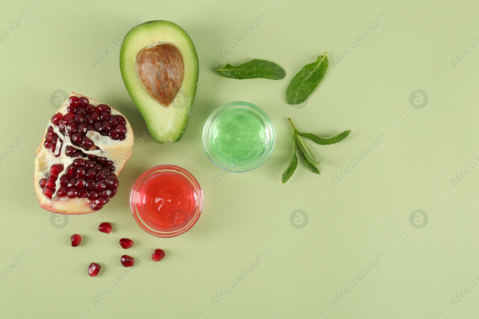 Photo of Flat lay composition with homemade cosmetic products and fresh ingredients on light green background, space for text. DIY beauty recipe