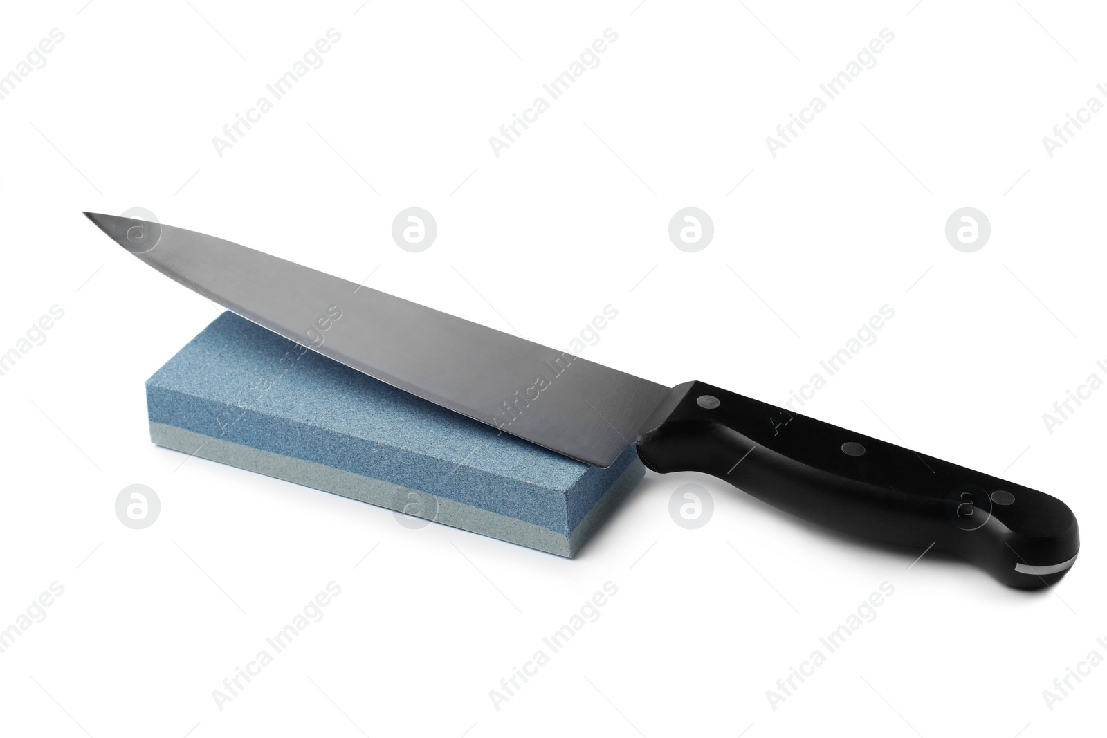Photo of Sharp chief's knife and grindstone isolated on white