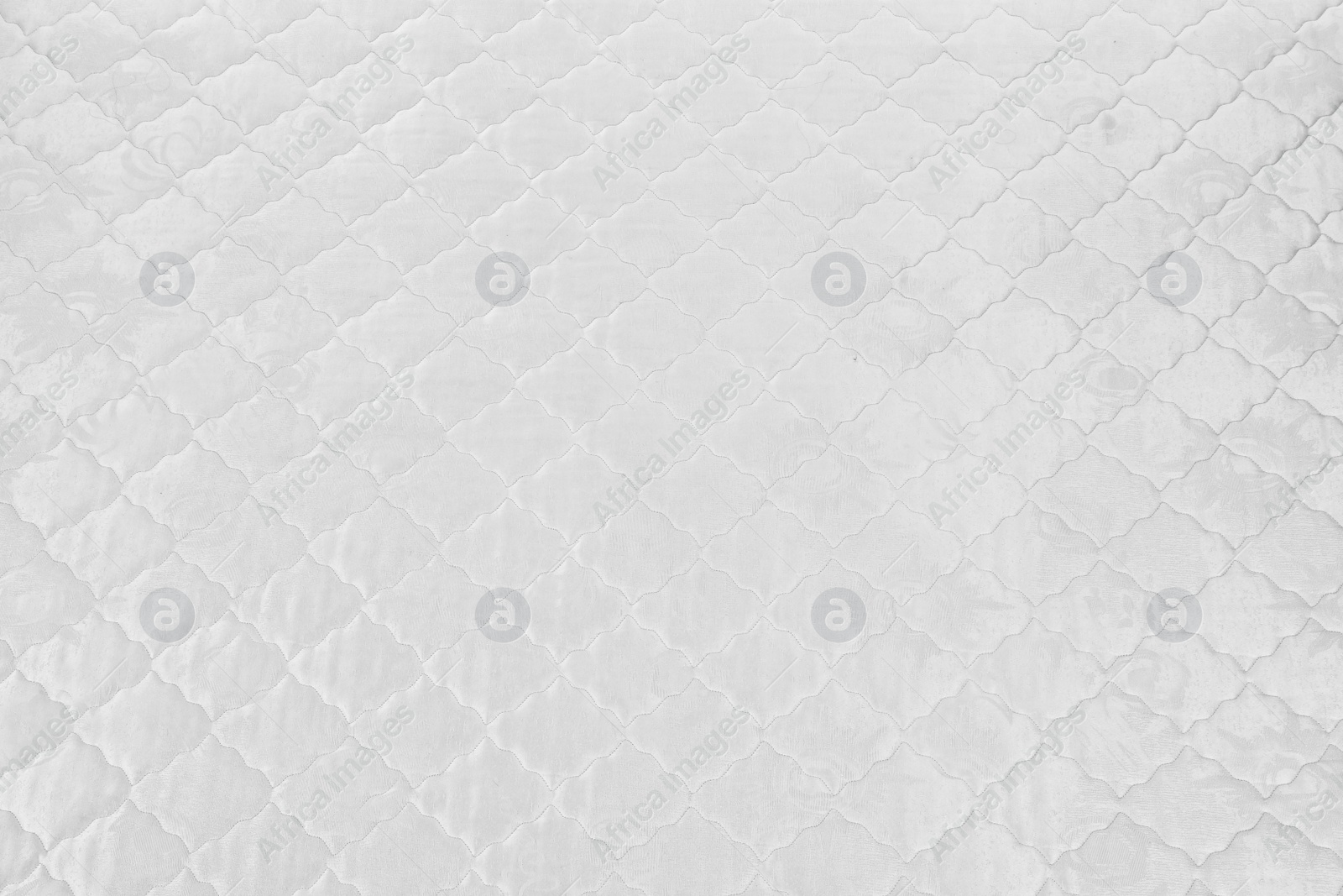 Photo of Modern white comfortable orthopedic mattress as background