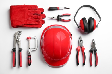 Photo of Flat lay composition with different construction tools on white background