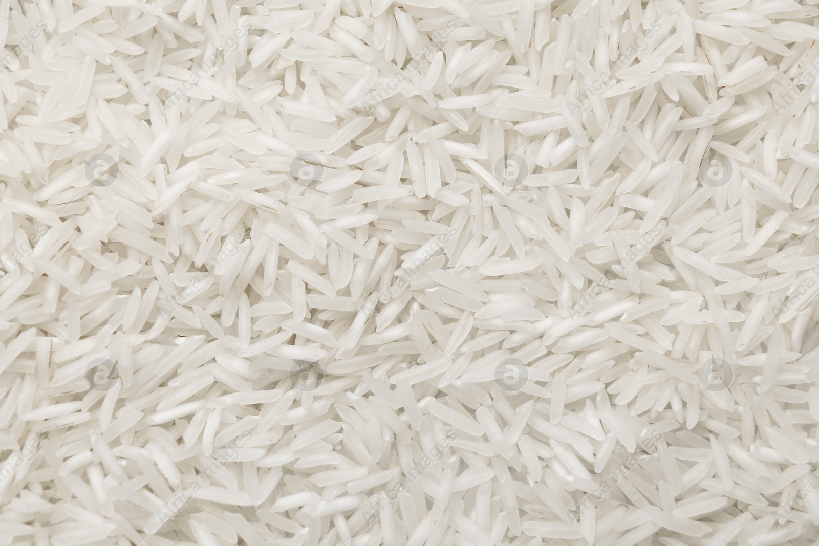 Photo of Raw basmati rice as background, top view