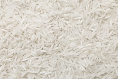 Photo of Raw basmati rice as background, top view