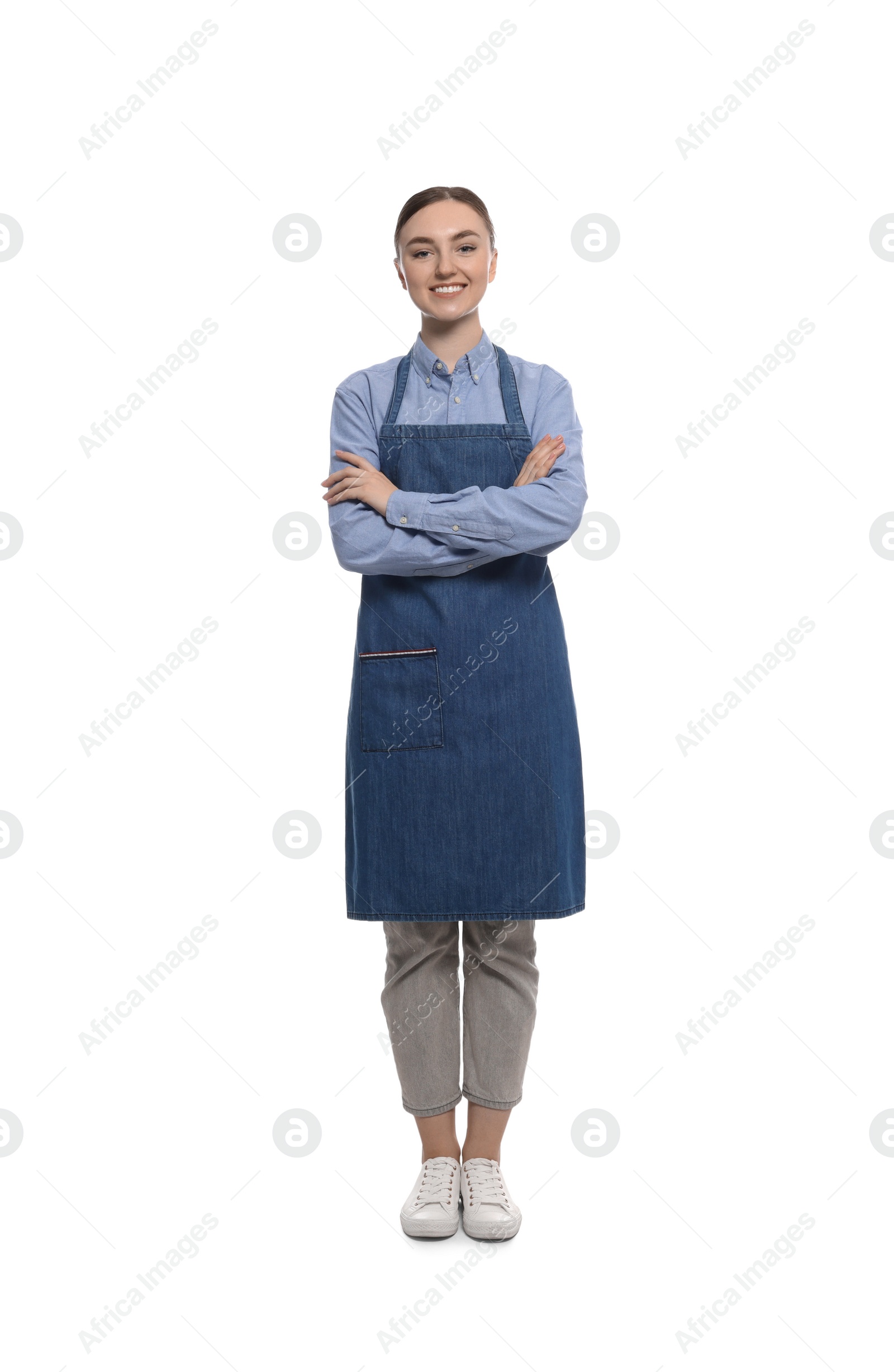 Photo of Beautiful young woman in clean denim apron on white background