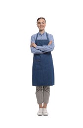 Beautiful young woman in clean denim apron on white background