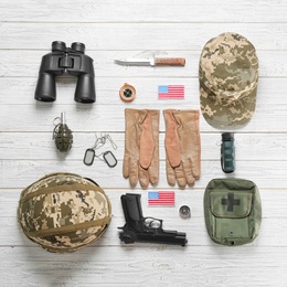 Photo of Set of military equipment on wooden background, flat lay