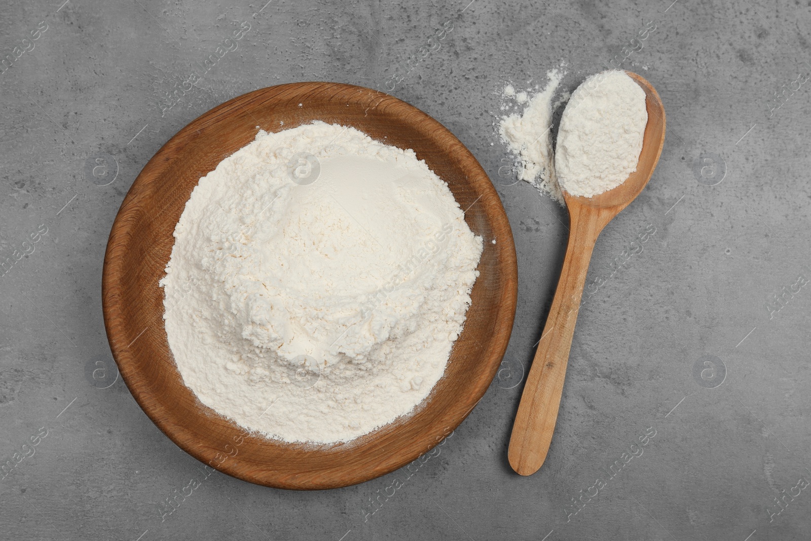 Photo of Flour on light grey background, flat lay
