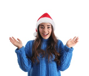 Beautiful emotional woman wearing Santa Claus hat on white background
