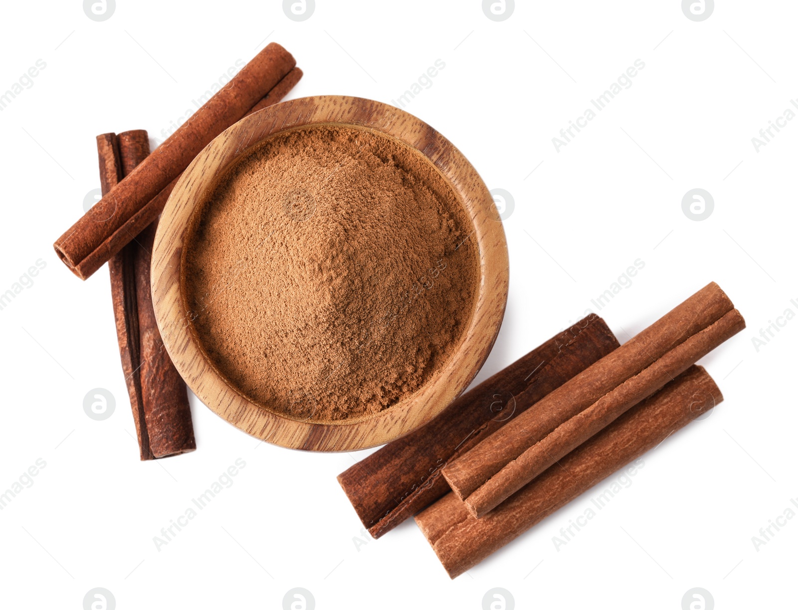 Photo of Dry aromatic cinnamon sticks and powder isolated on white, top view