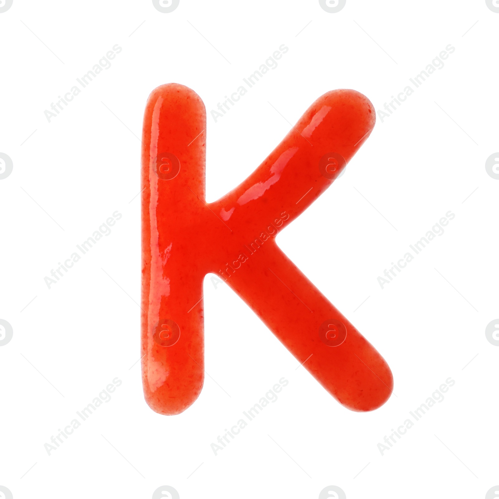 Photo of Letter K written with red sauce on white background